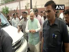 
      
      Amit Shah greeted with bouquets, shawls at BJP headquarters
      
      