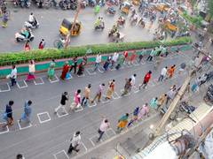 
      
      Markings drawn in Andhra's markets to maintain social distancing
      
      