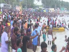 
      
      Tamil Nadu: Devotees flout COVID protocols as they bathe on...
      
      