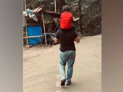 
      
      Taimur enjoys stroll on Saif's shoulders during family's trip...
      
      