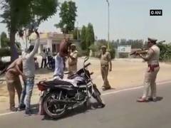 
      
      Police frisk motorists at gun point in Badaun, UP
      
      