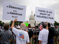 
      
      Small crowd gather at rally in support of US Capitol rioters
      
      