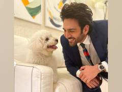 
      
      Kartik Aaryan cozies up with pet pooch Katori Aaryan
      
      