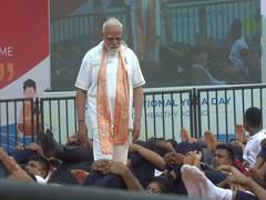 
      
      PM Modi helps participants correct their posture at Yoga event
      
      
