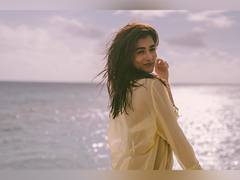 
      
      Pooja Hegde sets social media on fire in bikini, sheer shirt set
      
      