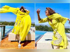 
      
      'Desi girl' Priyanka Chopra looks blissful in yellow suit
      
      