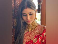 
      
      Mouni Roy makes the perfect new bride in red saree, gold jewellery
      
      