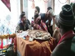 
      
      U'khand: Priests at temple cover donation boxes with clothes...
      
      
