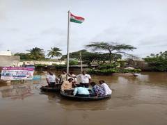 
      
      National flag hoisted in floodwaters in Shurpali village
      
      