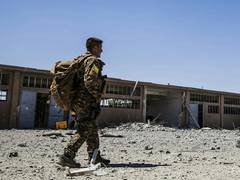 
      
      Kurds fully withdraw from besieged Syria border town
      
      