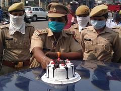 
      
      Women police officers celebrate Mother's Day with a slice of cake
      
      
