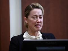 
      
      Amber Heard bursts into tears as she testifies against Depp
      
      