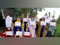 
      
      Afghan women hold protest against Taliban after hijab decree
      
      