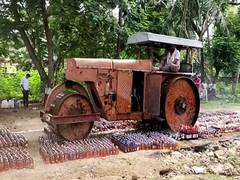 
      
      Seized liquor bottles worth Rs 72 lakh crushed under road...
      
      
