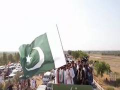 
      
      Imran Khan supporters turn protest into sit-in as Pakistan boils
      
      