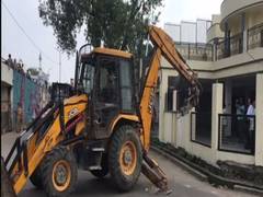 
      
      Prayagraj authorities demolish illegal portions of former MP...
      
      