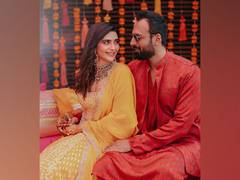 
      
      Karishma Tanna looks resplendent in yellow for her mehendi...
      
      