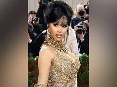 
    Cardi B shines in all-gold dress at Met Gala 2022
    