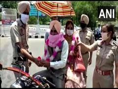 
      
      Amid lockdown Patiala man takes his bride home on motorbike,...
      
      