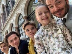 
      
      David Beckham cheers for wife Victoria with their kids 
      
      