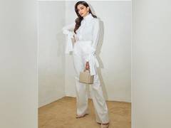 
    Deepika Padukone is a vision in white posing for the camera
    