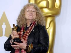 
      
      Jenny Beavan scores best costume design Oscar for 'Cruella'
      
      