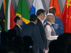 
      
      BRICS 2023: PM Modi pictured having brief conversation with Xi
      
      