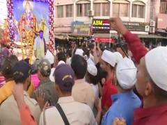 
      
      Muslims shower flowers on Hanuman Jayanti procession
      
      