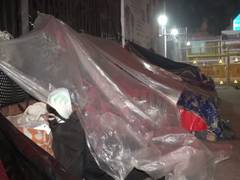 
      
      Patients & relatives brave chilling winter on footpath...
      
      