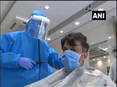 
      
      Workers at Salon in Gujarat's Kheda wear PPE kits while...
      
      