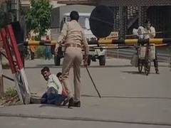 
      
      Cop suspended in UP's Hapur for beating labourers, making...
      
      