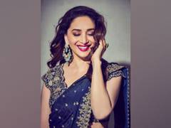 
      
      Madhuri Dixit charms fans with stunning pictures in 'blue...
      
      