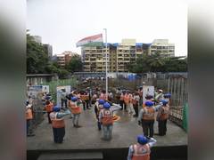 
      
      Migrant workers at Nahar's Amrit Shakti construction site...
      
      
