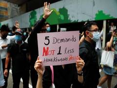 
      
      Hong Kong protestors march as police ban weekend rally
      
      