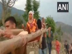 
      
      J-K: Patient carried to hospital on makeshift stretcher in Doda
      
      