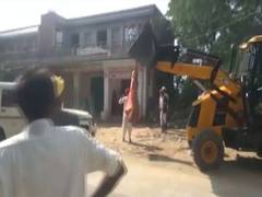 
      
      Rajasthan: Woman sarpanch climbs over JCB machine to stop...
      
      