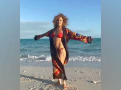 
      
      Jennifer Lopez flaunts 'beach body' as she meditates on shore
      
      