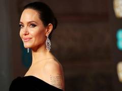 
      
      Angelina Jolie tries 'not to cry' as she drops son to college
      
      