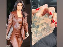 
      
      Kourtney Kardashian makes her relationship with Travis Barker...
      
      