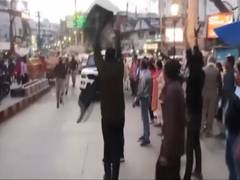 
      
      UP polls: Mamata shown black flags, sits on stair to watch...
      
      