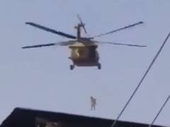 
      
      Afghan journalists say man seen hanging from helicopter a...
      
      