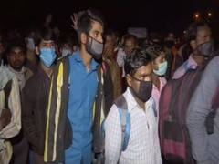 
      
      Uncertain about their future, migrants begin journey on foot...
      
      