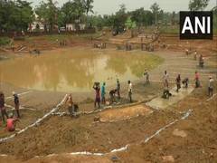 
      
      Migrant workers returning to village getting work under...
      
      