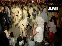 
      
      Police detain people at Mumbai candlenight vigil called to...
      
      
