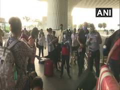 
      
      Passengers arrive at Mumbai airport as domestic air travel...
      
      