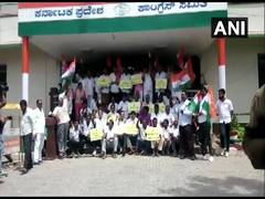 
      
      Amid turmoil, Congress workers hold protest outside Bengaluru...
      
      