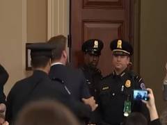 
      
      Protester disrupts impeachment hearing, accuses House...
      
      