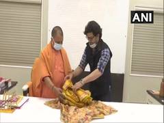 
      
      Clothes made of khadi for Ramlalla presented to UP CM
      
      