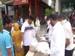 
      
      Congress distributing ration to poor families in Delhi
      
      