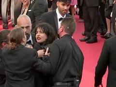 
      
      Topless woman storms Cannes red carpet to protest against rape
      
      